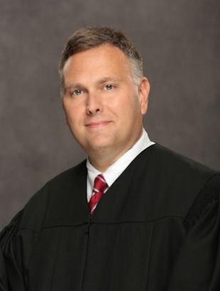 Circuit Judge Greg A. Tynan