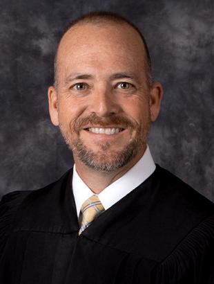 Circuit Judge Keith A. Carsten