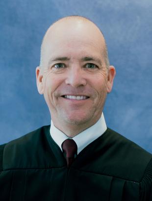 Circuit Judge Keith A. Carsten